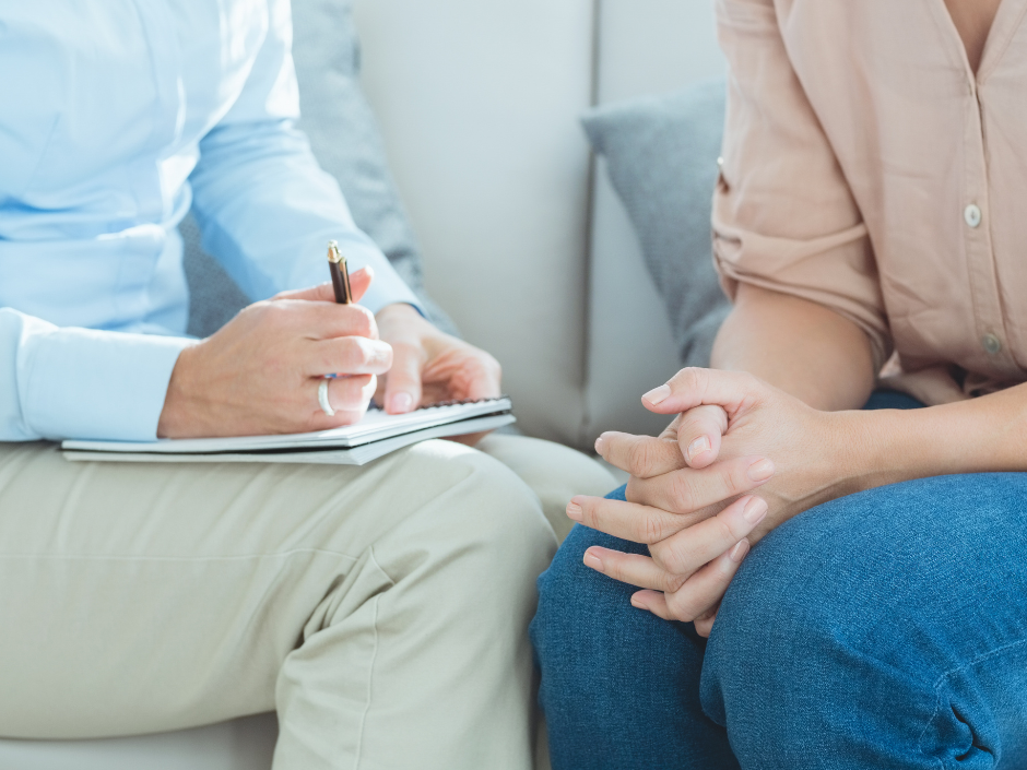 close up on two people sitting on couch