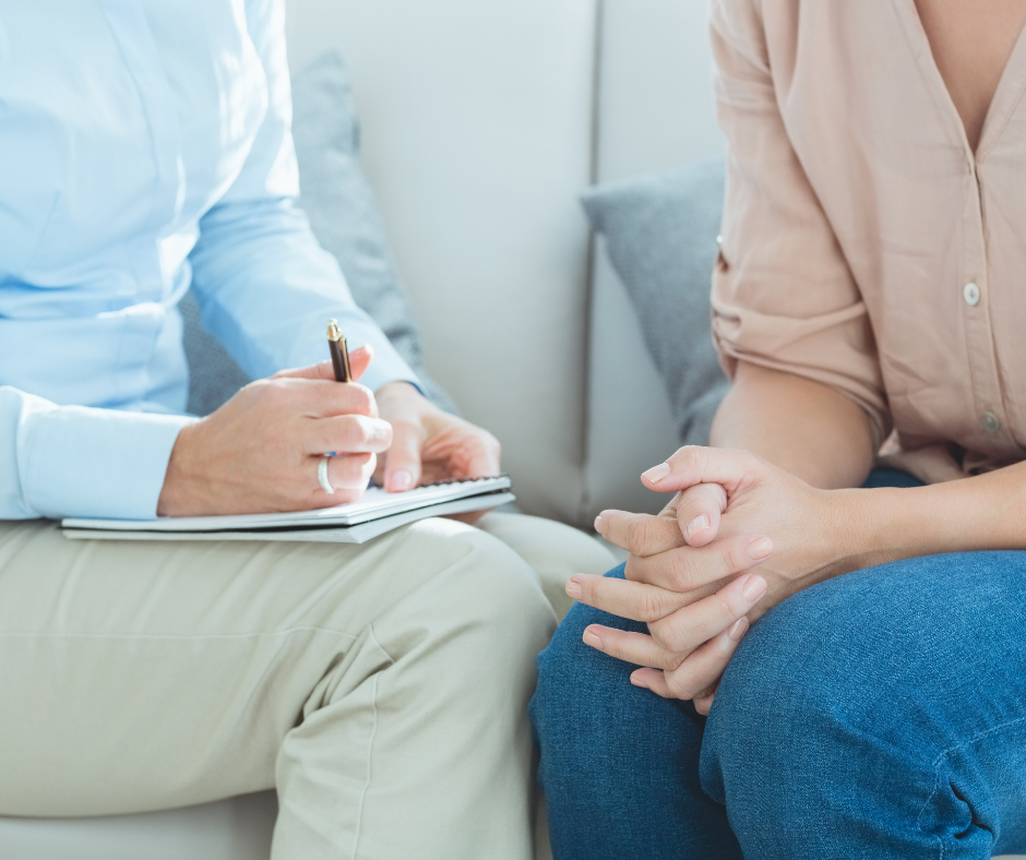 close up on two people sitting on couch