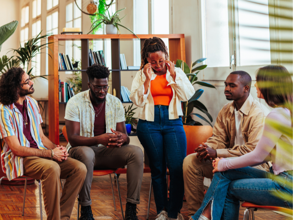 group of people listen to women talking